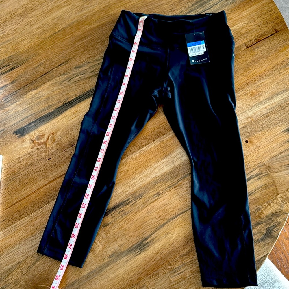 Nike running tights.  mid-rise, tight fit,  crop length.